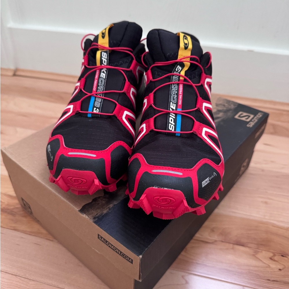 Salomon Trail Shoes with Red and Orange Accents